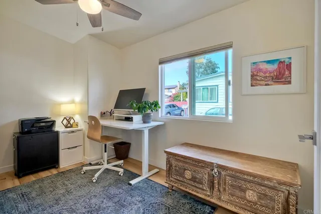 a work room with furniture and windows