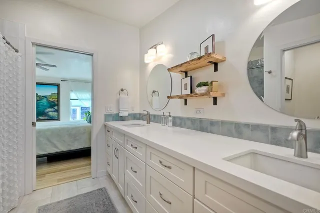 a view of a patio with table and chairs potted plants and a small yard