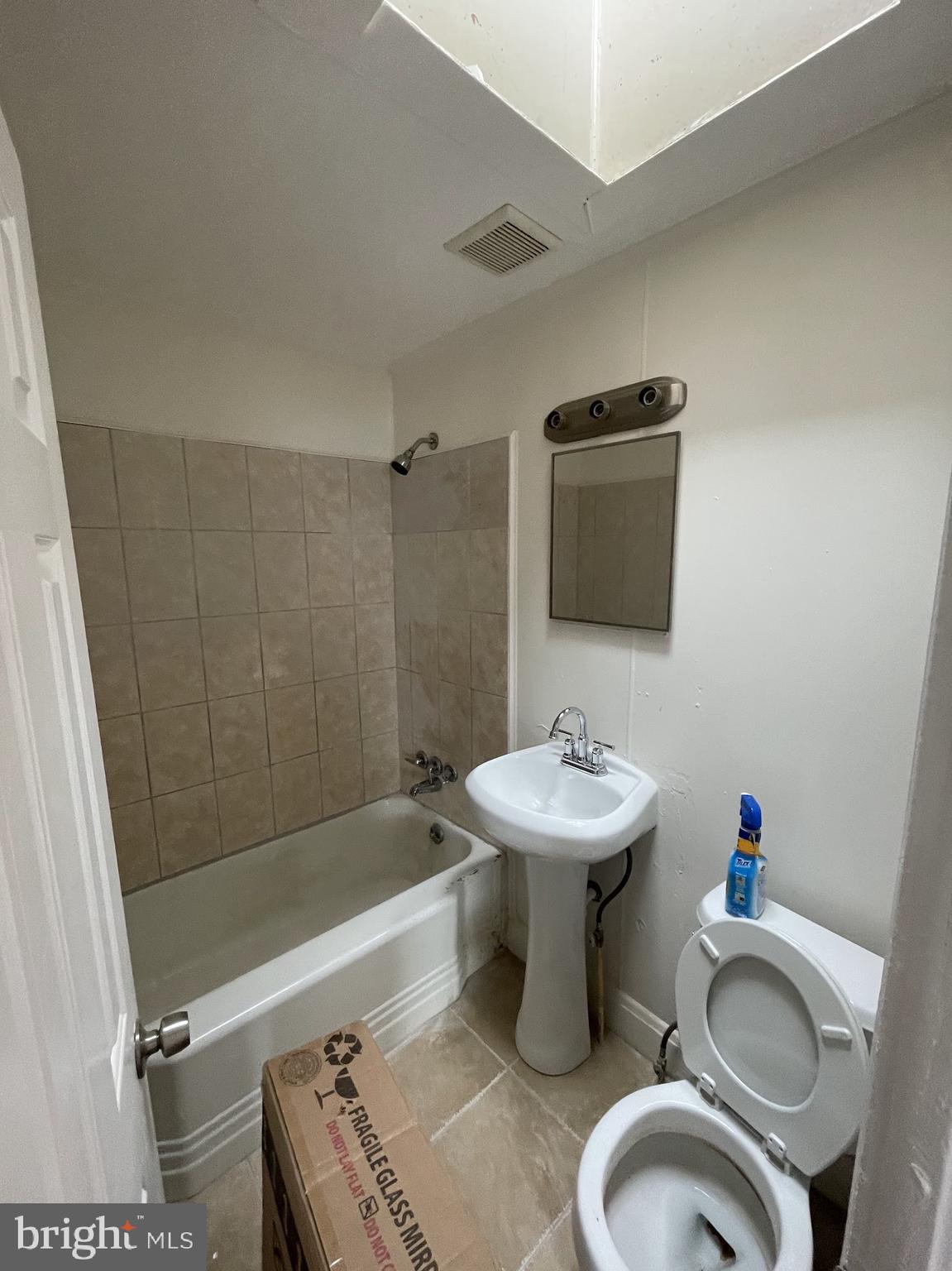 100 Willow Spring Road Dundalk, MD 21222 - Photo 4 of 8 a bathroom with a sink a toilet and shower