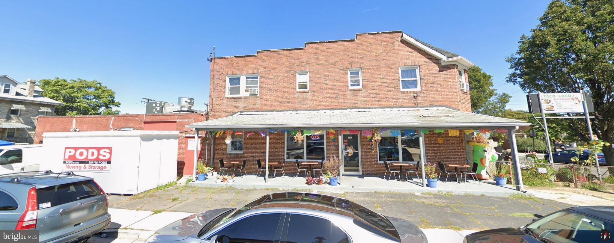 100 Willow Spring Road Dundalk, MD 21222 - Photo 6 of 8 a backyard of a house with yard and outdoor seating