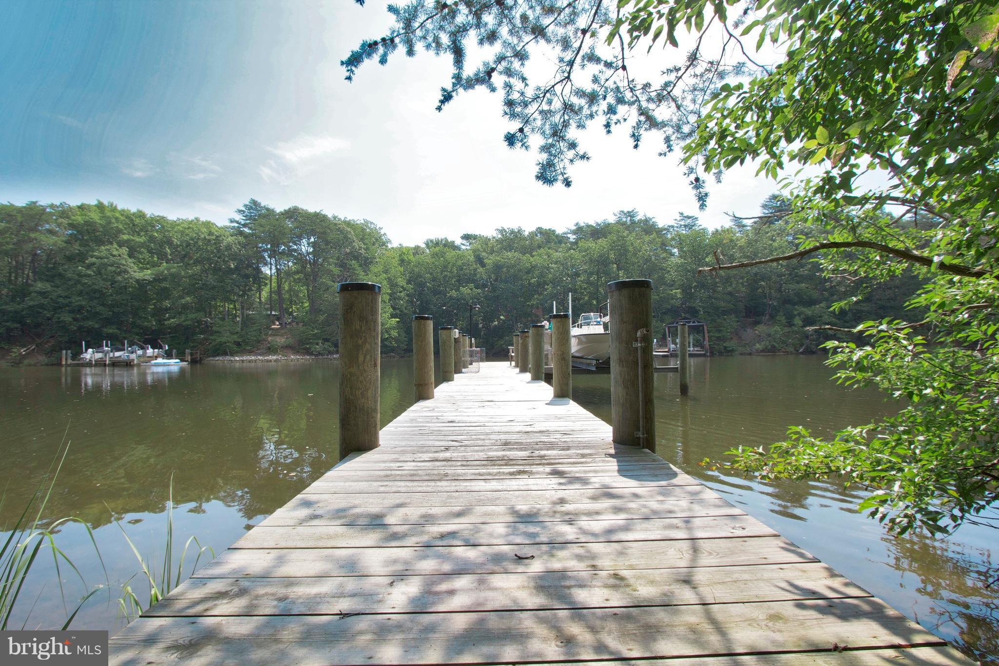13422 Olivet Road Lusby, MD 20657 - Photo 1 of 23 a view of a lake with a large trees