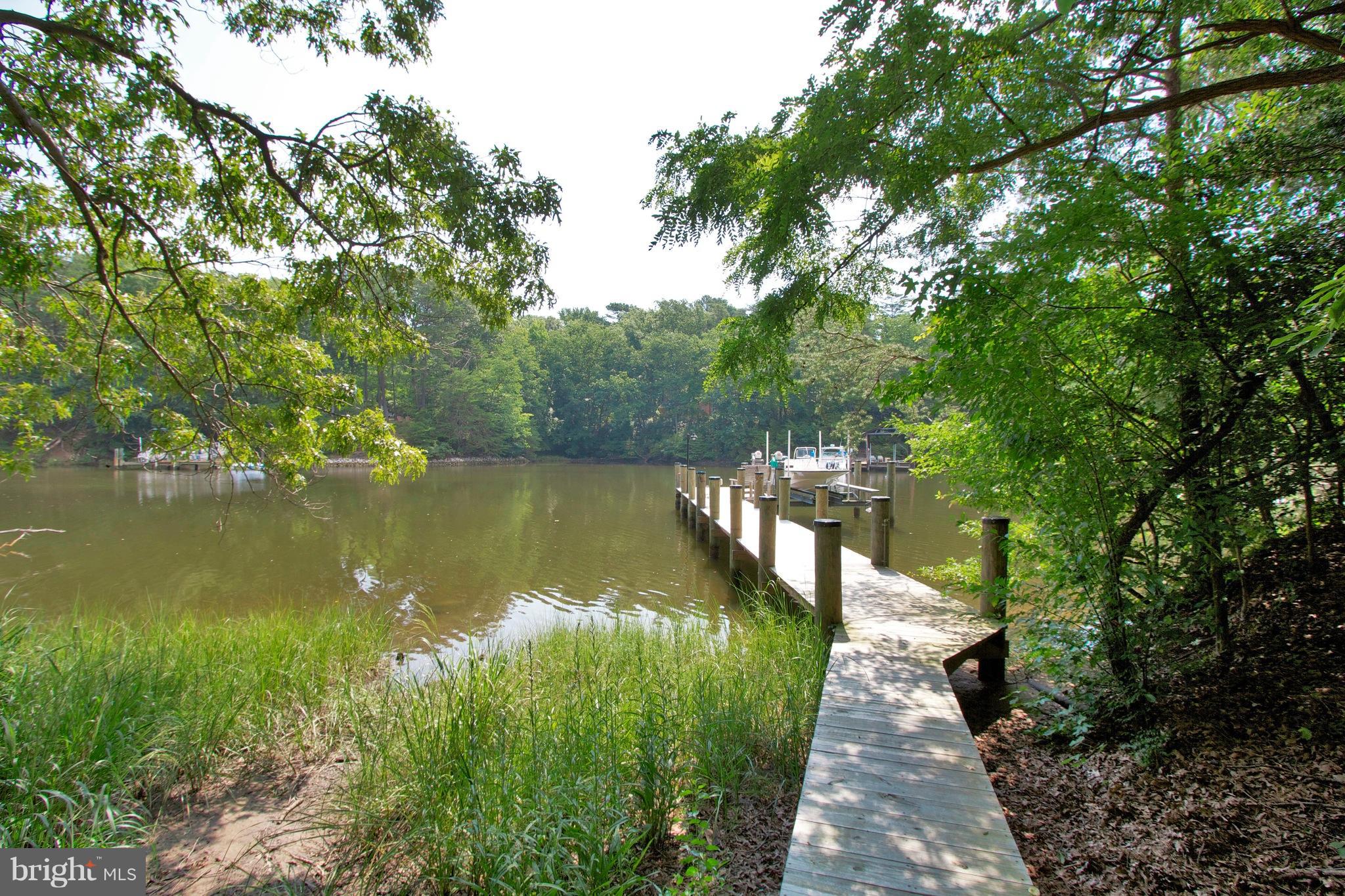 13422 Olivet Road Lusby, MD 20657 - Photo 2 of 23 a view of a lake view with a garden