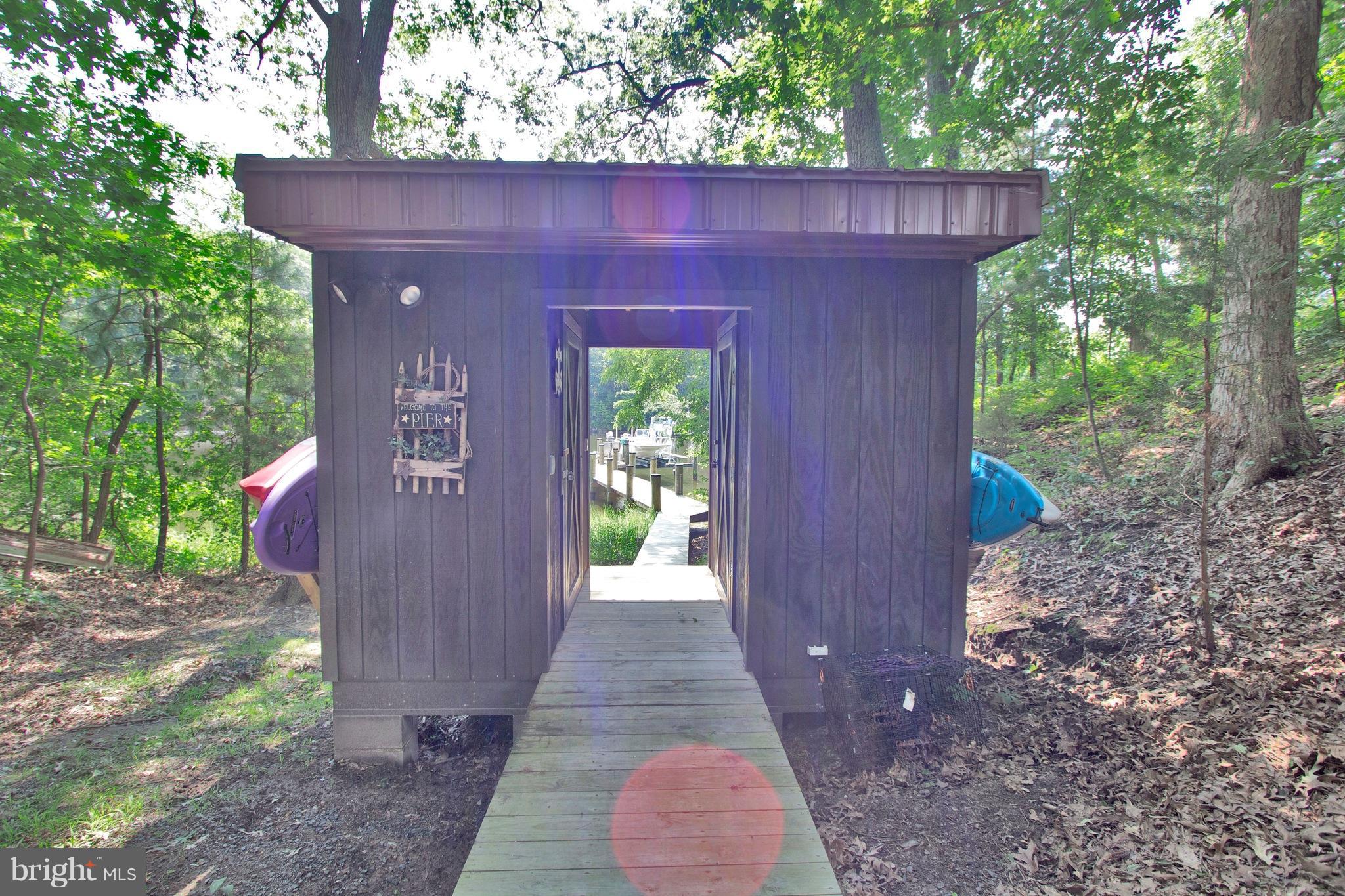 13422 Olivet Road Lusby, MD 20657 - Photo 12 of 23 a view of a pathway with a small yard