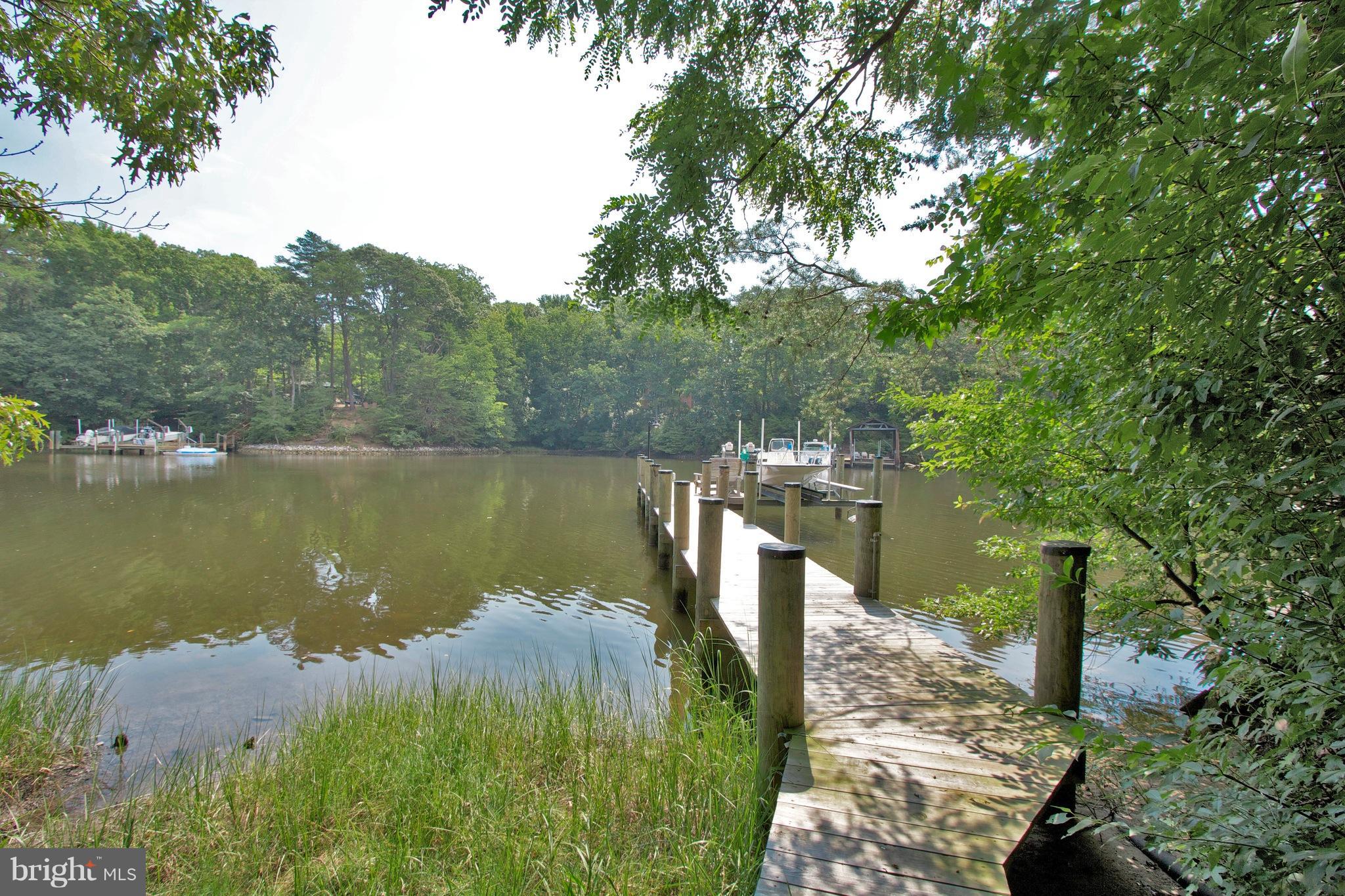 13422 Olivet Road Lusby, MD 20657 - Photo 16 of 23 a view of a lake in middle of forest