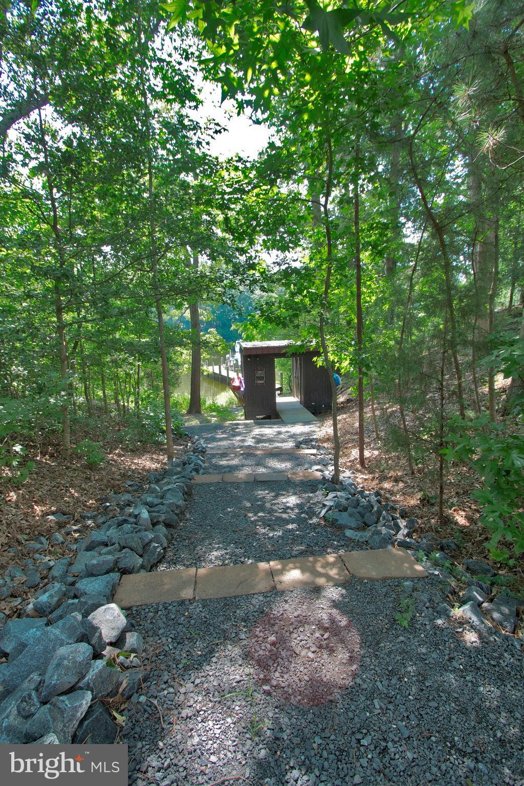 13422 Olivet Road Lusby, MD 20657 - Photo 10 of 23 a view of a backyard with large trees