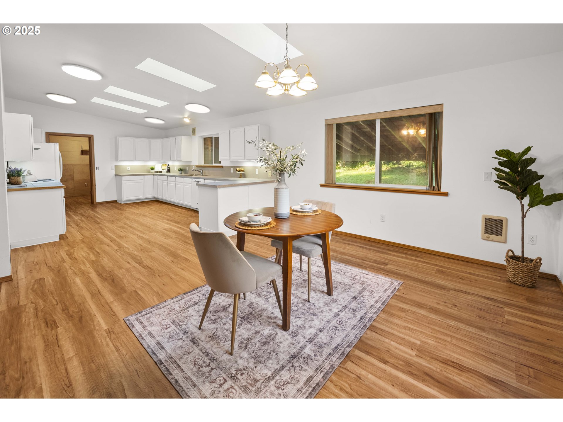 89022 Welch Road Astoria, OR 97103 - Photo 11 of 42 a view of a dining room with furniture and wooden floor