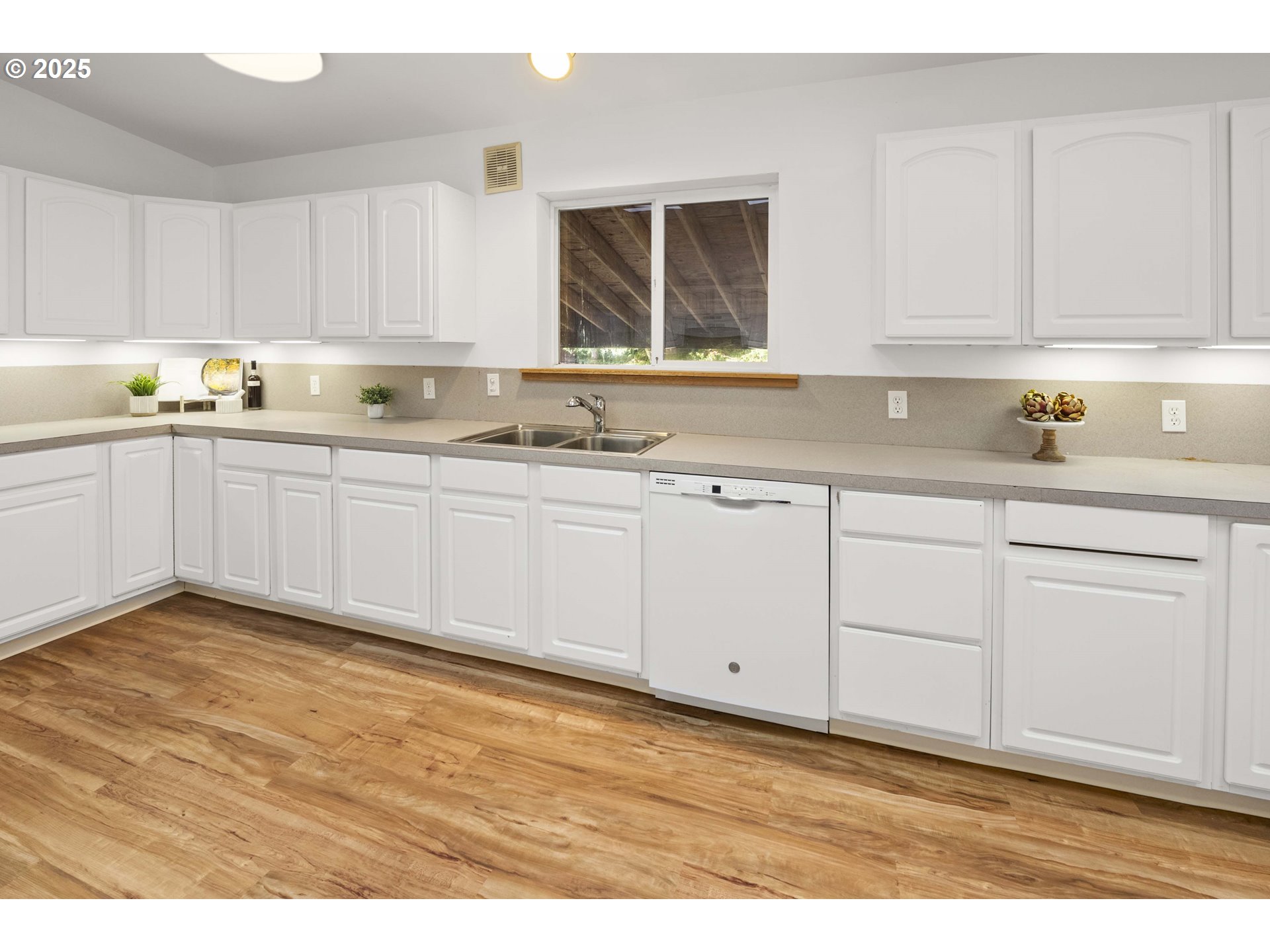 89022 Welch Road Astoria, OR 97103 - Photo 15 of 42 a kitchen with granite countertop white cabinets and white appliances