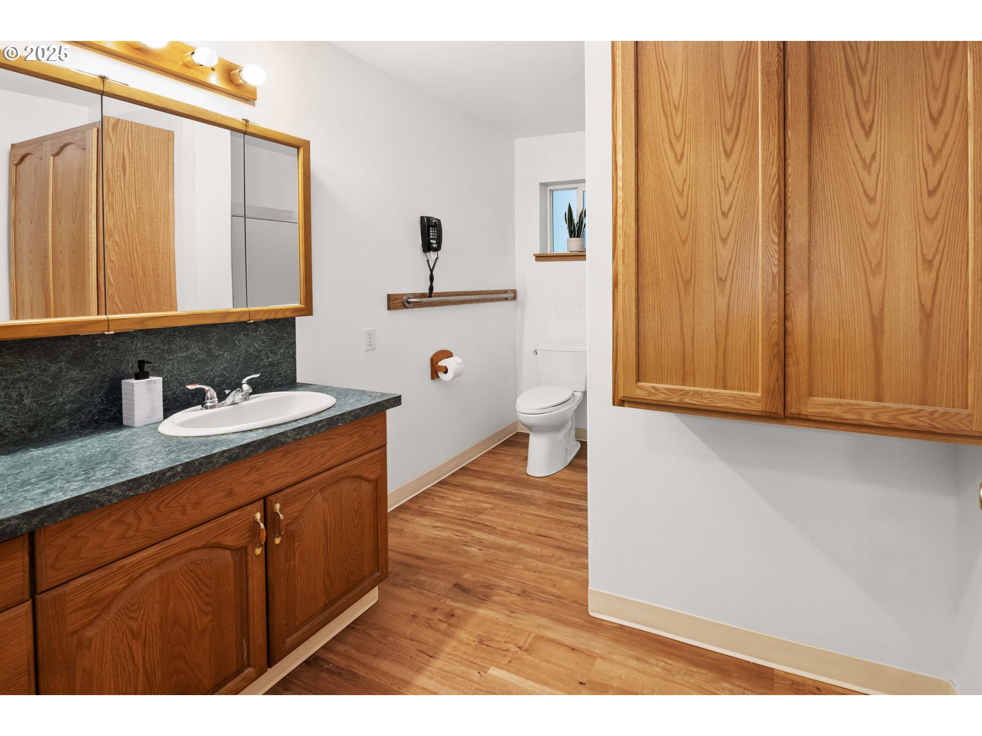 89022 Welch Road Astoria, OR 97103 - Photo 20 of 42 a bathroom with a sink a mirror and a shower