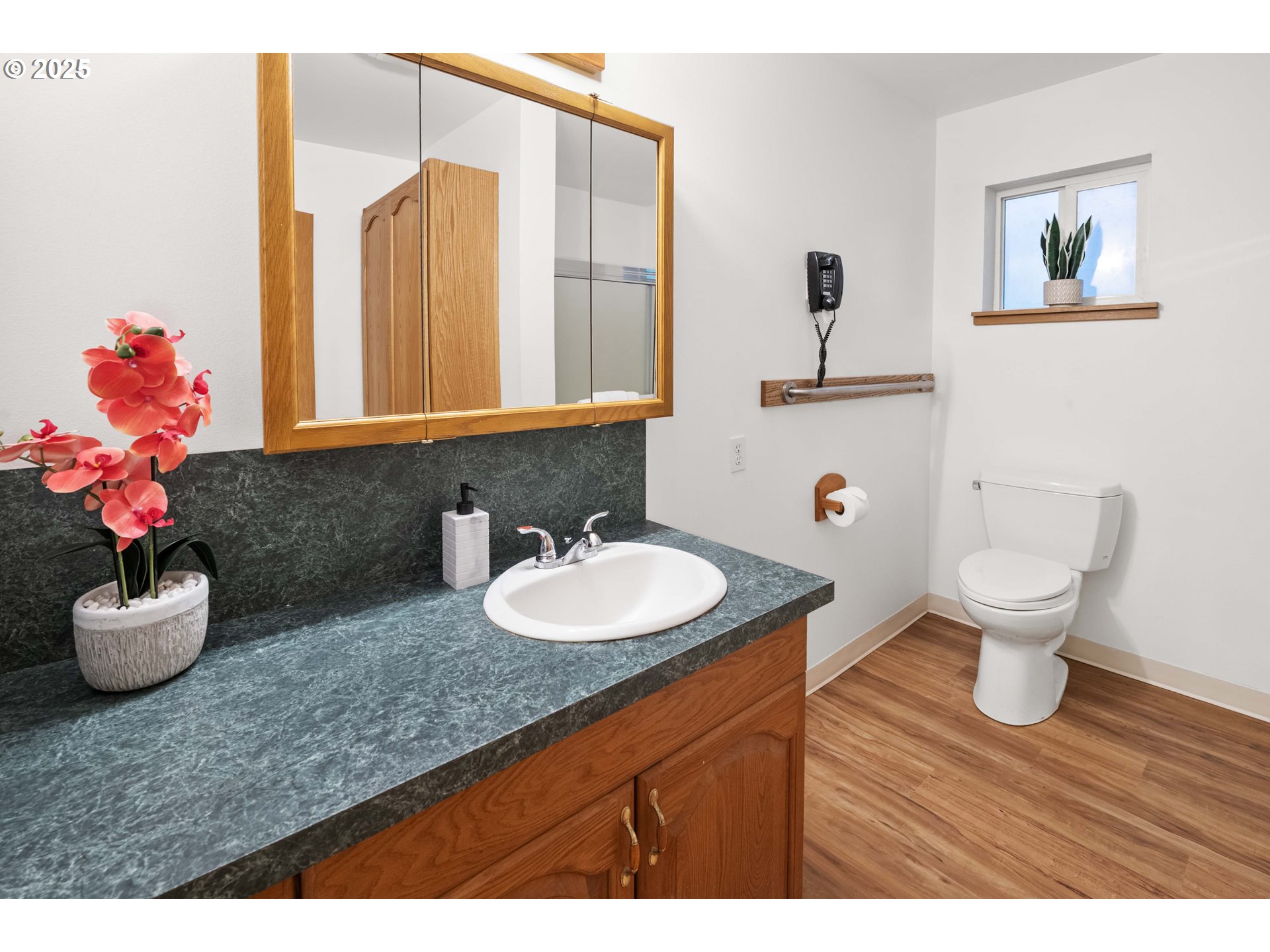 89022 Welch Road Astoria, OR 97103 - Photo 21 of 42 a bathroom with a granite countertop sink mirror and toilet