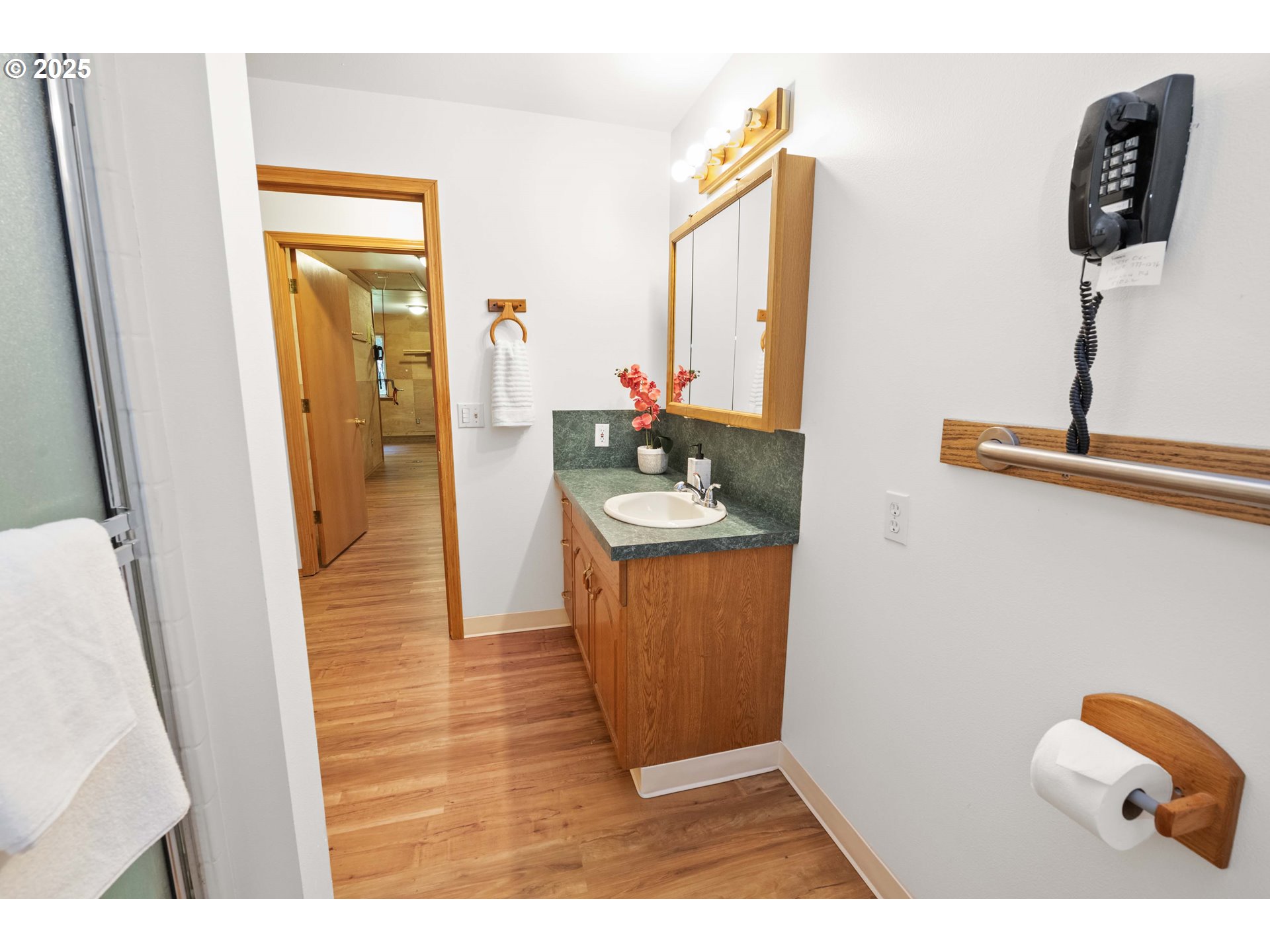 89022 Welch Road Astoria, OR 97103 - Photo 22 of 42 a hallway with a table and a mirror