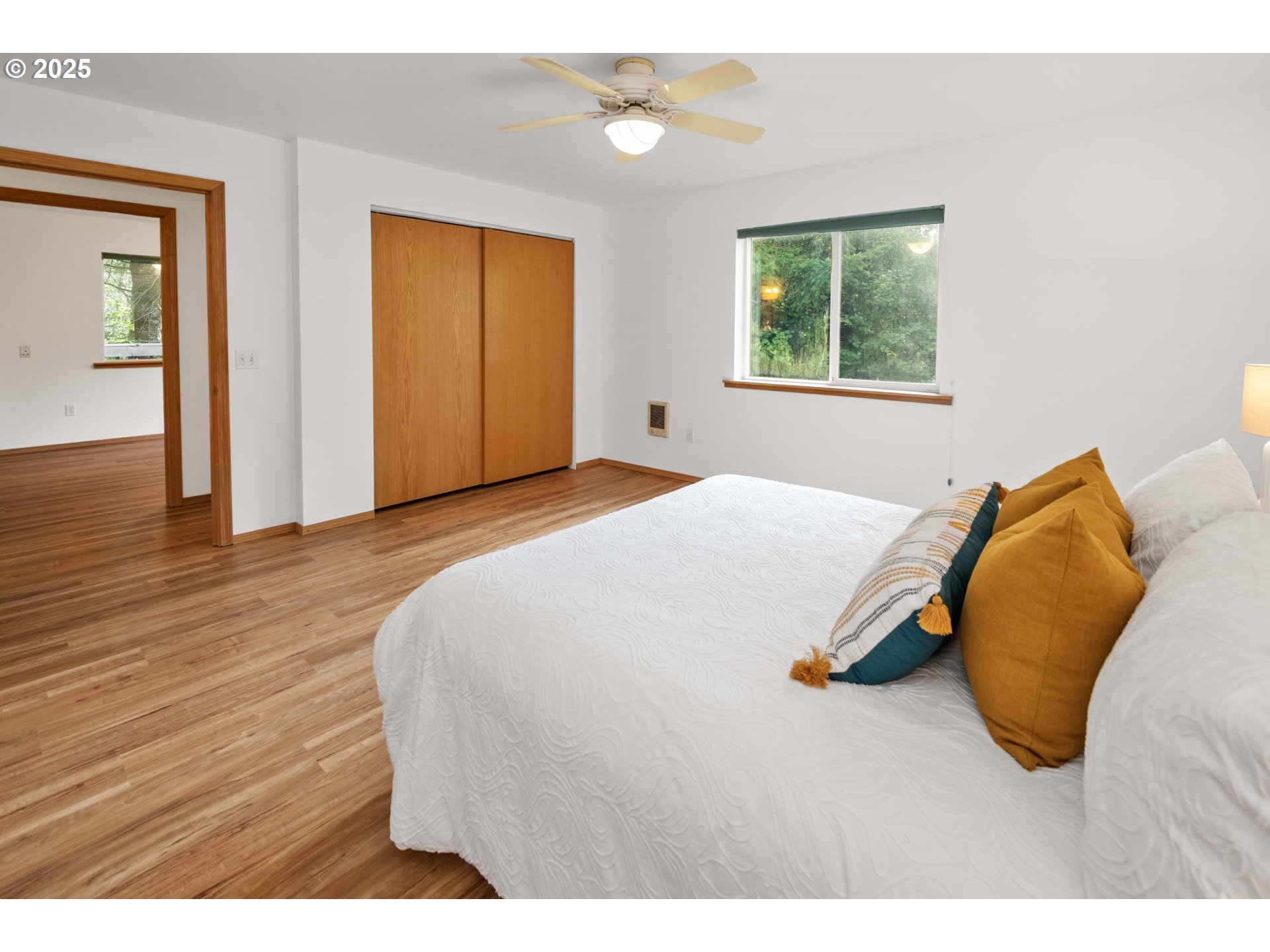 89022 Welch Road Astoria, OR 97103 - Photo 25 of 42 a bedroom with a bed and wooden floor