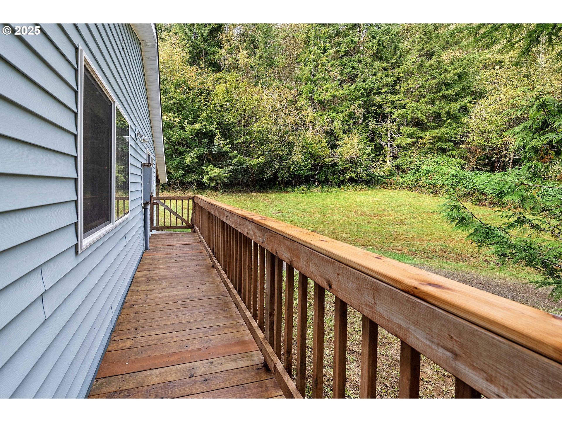 89022 Welch Road Astoria, OR 97103 - Photo 3 of 42 a view of balcony with wooden floor and fence