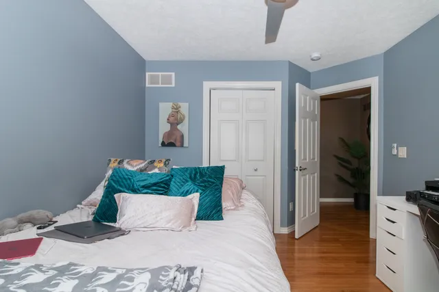 a bathroom with a tub a sink and a window