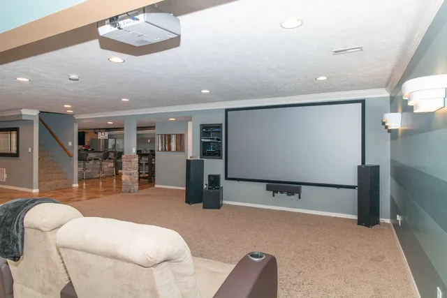 a large bed sitting in a bedroom next to a window