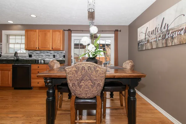 a kitchen with a refrigerator a stove top oven a sink and dishwasher