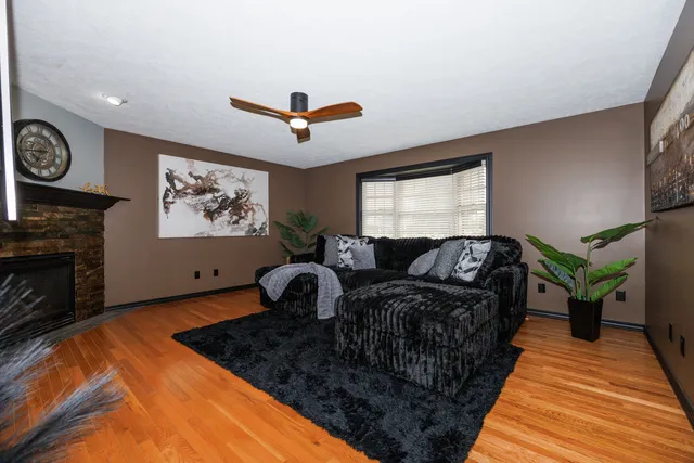 a bedroom with furniture and a fireplace