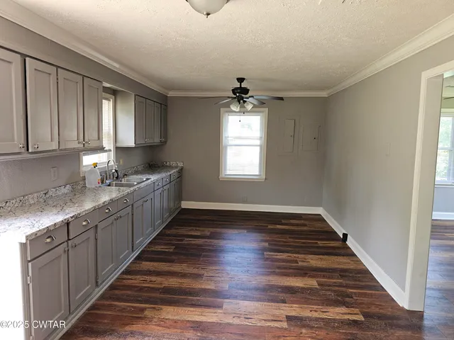 a kitchen with sink and window