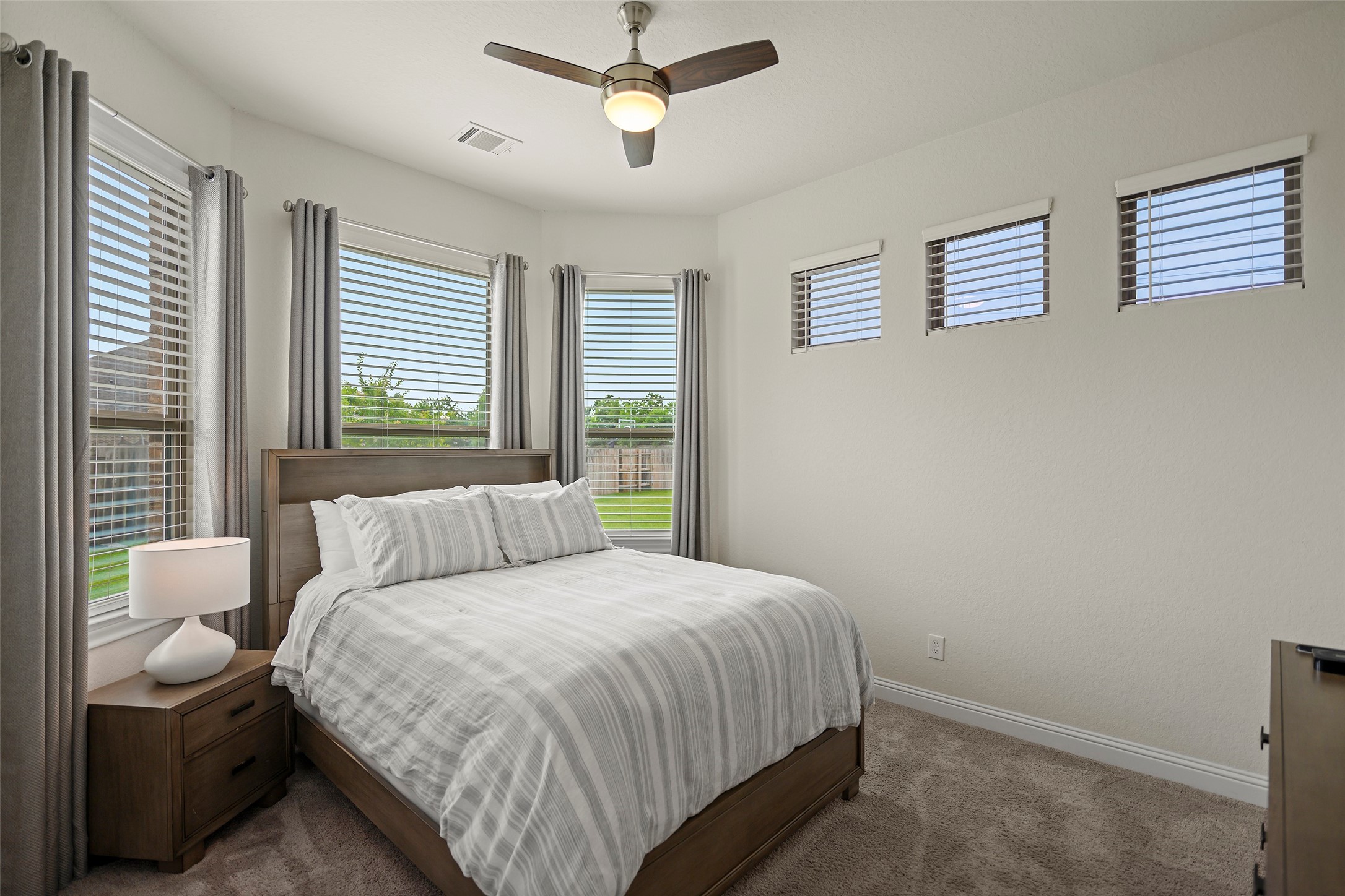 20330 Rosegold Way Spring, TX 77379 - Photo 21 of 48 Private secondary bedroom filled with natural light and views of the backyard.