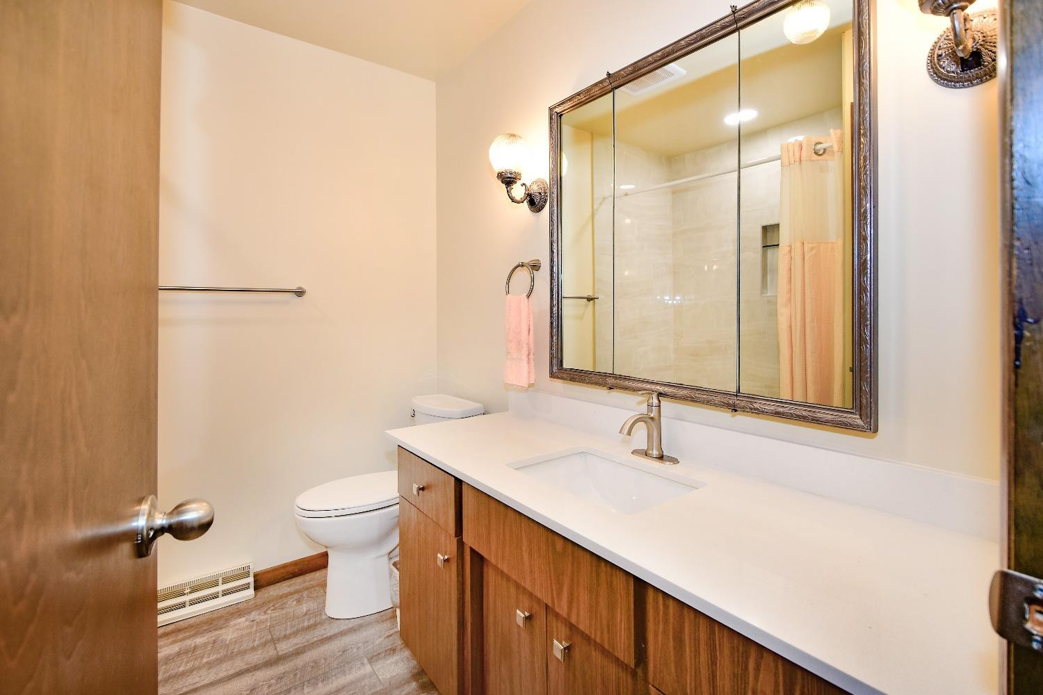 9020 Bryan Street Crown Point, IN 46307 - Photo 13 of 31 a bathroom with a sink and a mirror