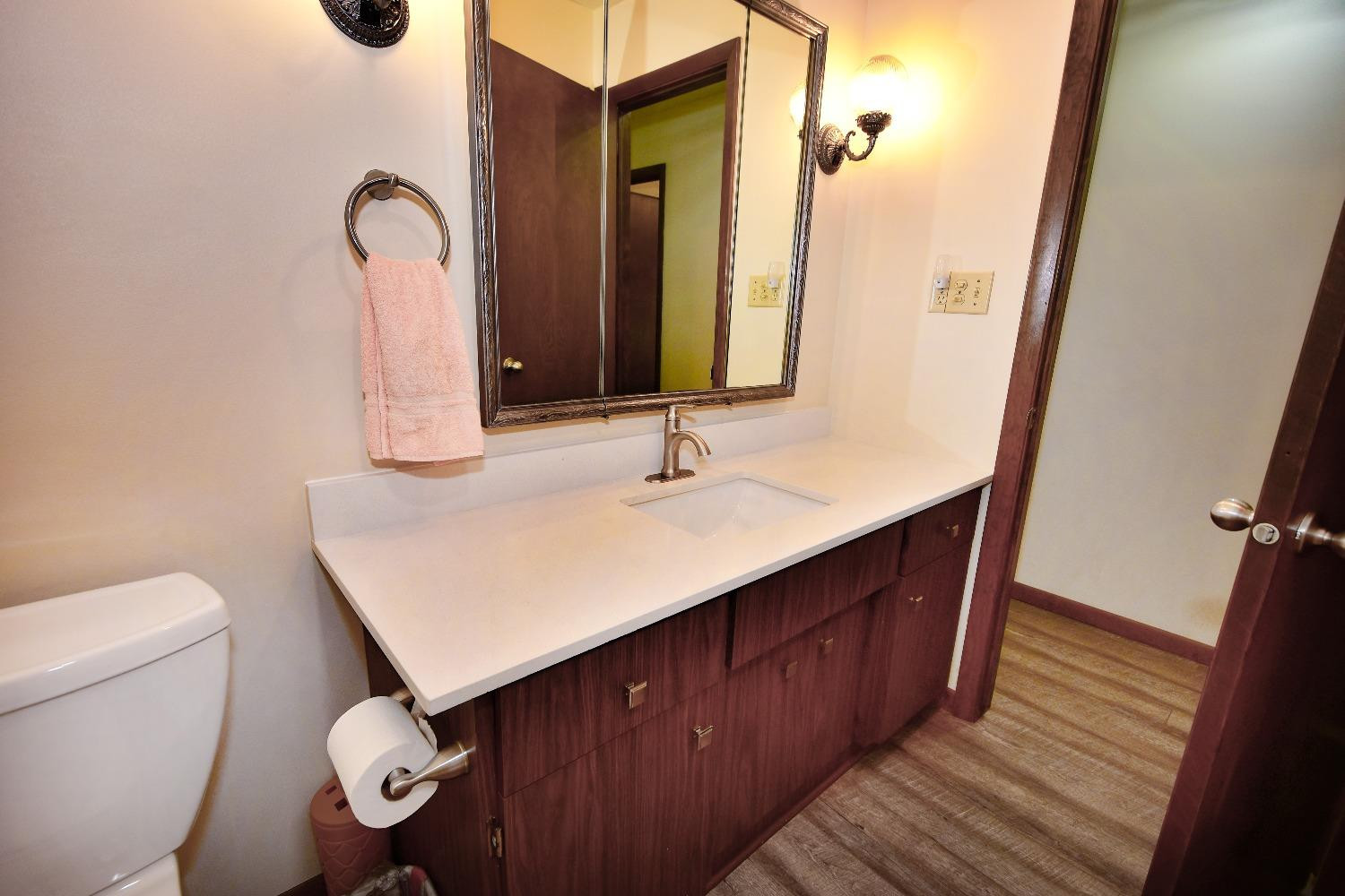 9020 Bryan Street Crown Point, IN 46307 - Photo 14 of 31 a bathroom with a sink a toilet and mirror