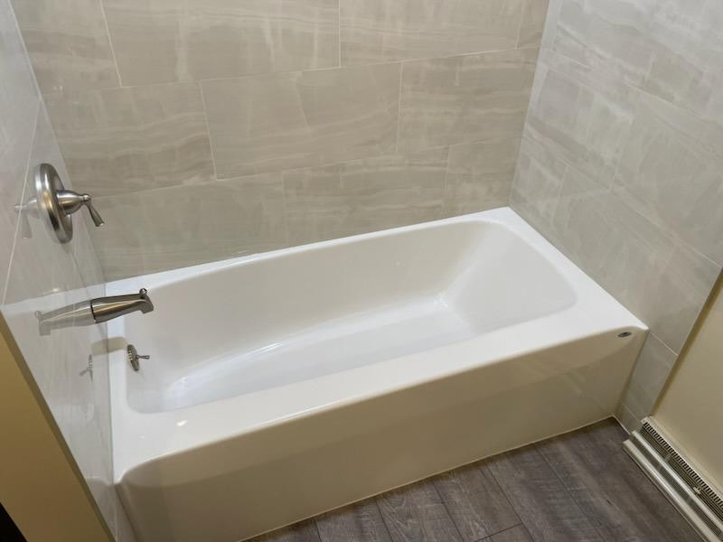 9020 Bryan Street Crown Point, IN 46307 - Photo 15 of 31 a close up of a bathtub in a bathroom