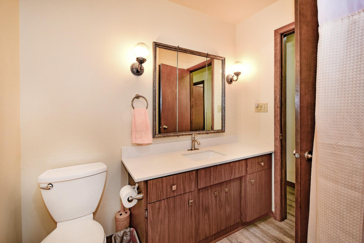 9020 Bryan Street Crown Point, IN 46307 - Photo 17 of 31 a bathroom with a toilet sink and mirror