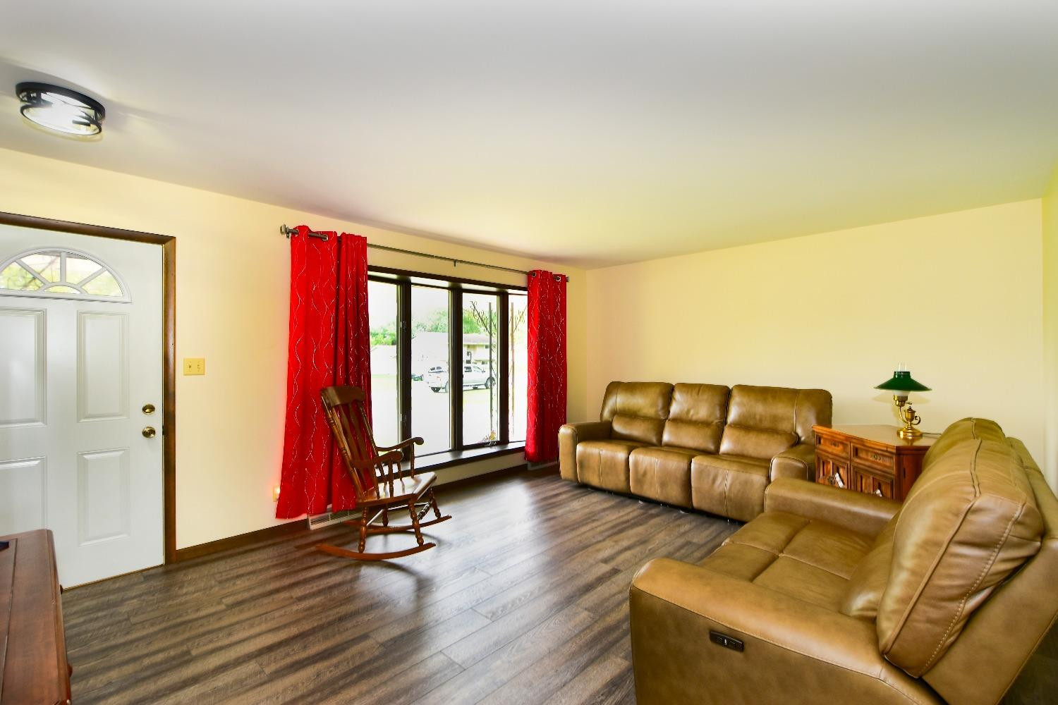 9020 Bryan Street Crown Point, IN 46307 - Photo 2 of 31 a living room with furniture gym equipment and a large window
