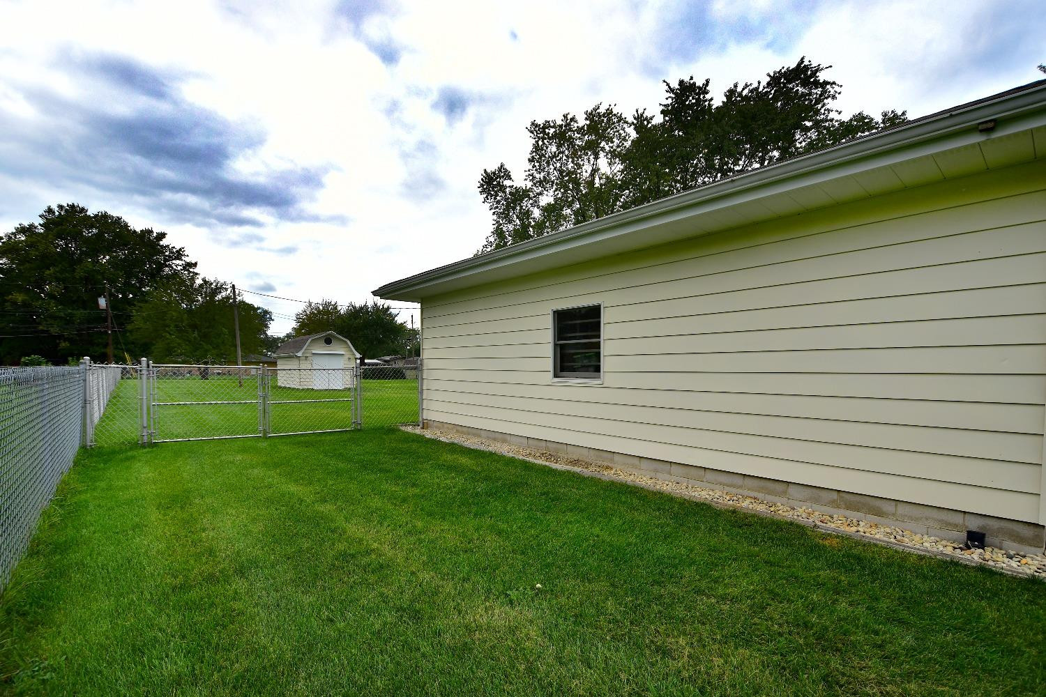 9020 Bryan Street Crown Point, IN 46307 - Photo 23 of 31 a view of a backyard with a garden