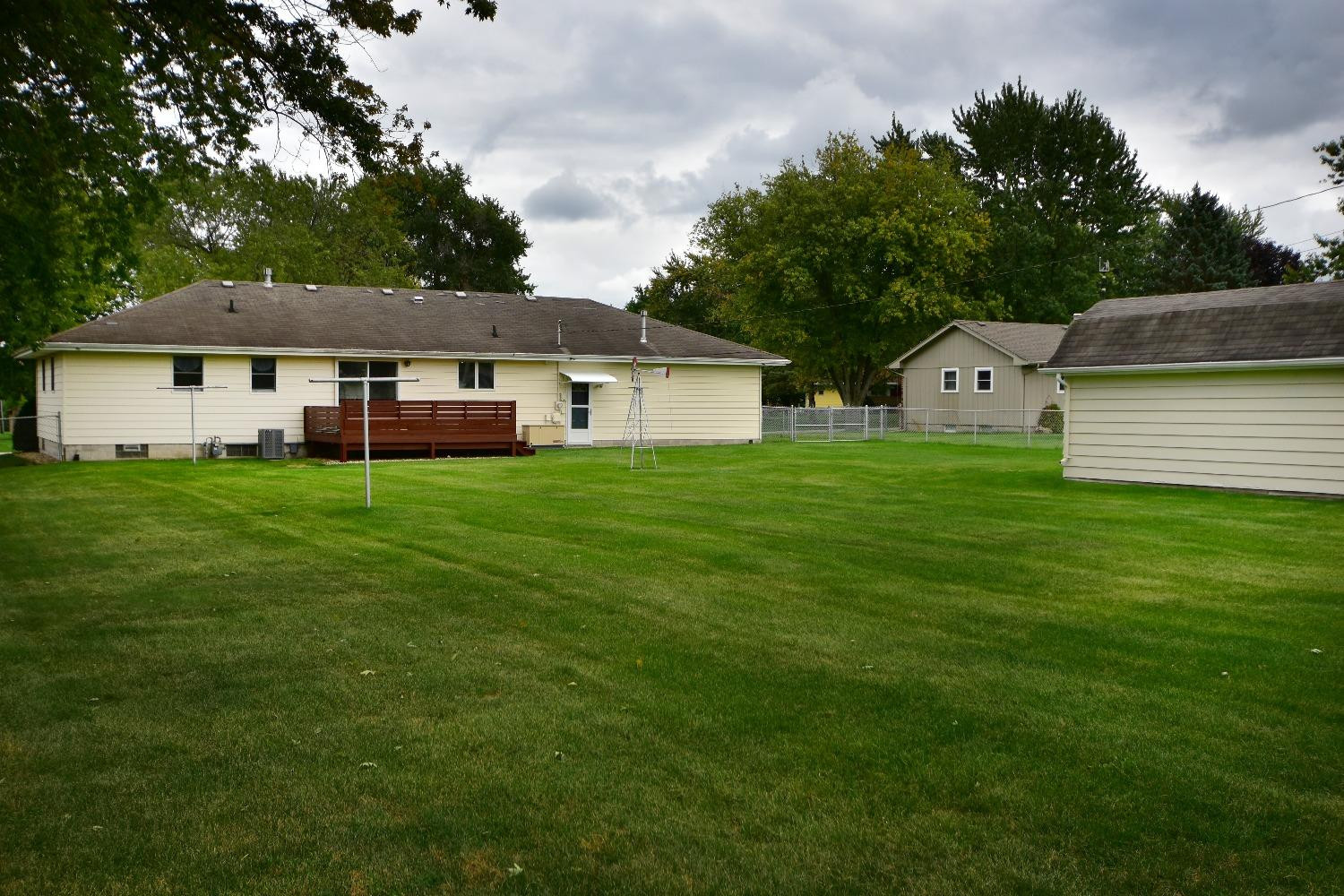 9020 Bryan Street Crown Point, IN 46307 - Photo 26 of 31 a front view of a house with a garden and trees