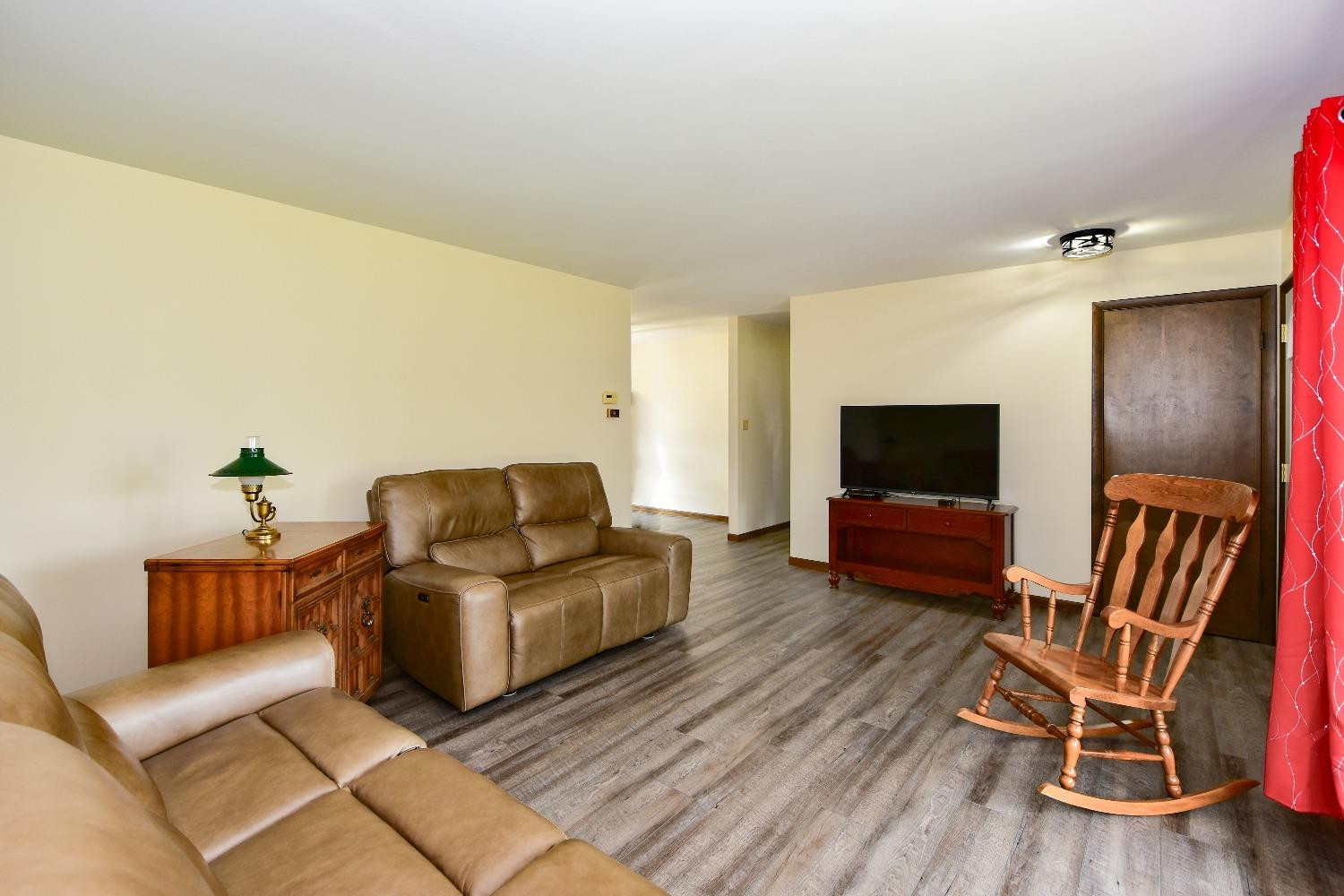 9020 Bryan Street Crown Point, IN 46307 - Photo 3 of 31 a living room with furniture and a flat screen tv