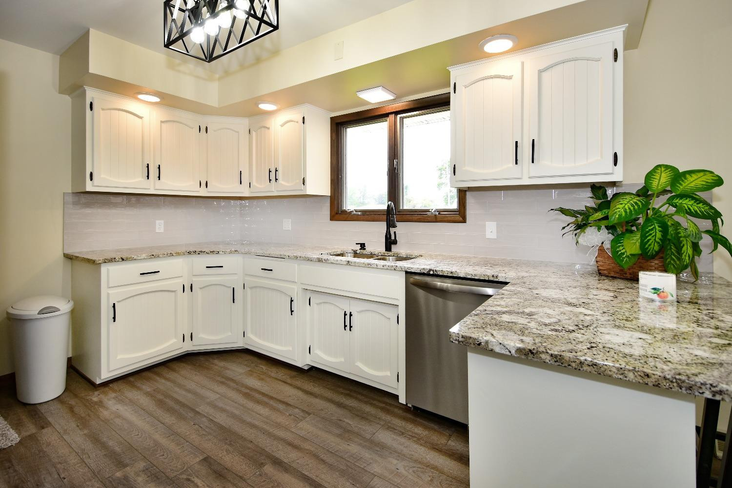 9020 Bryan Street Crown Point, IN 46307 - Photo 7 of 31 a kitchen with sink stove and cabinets
