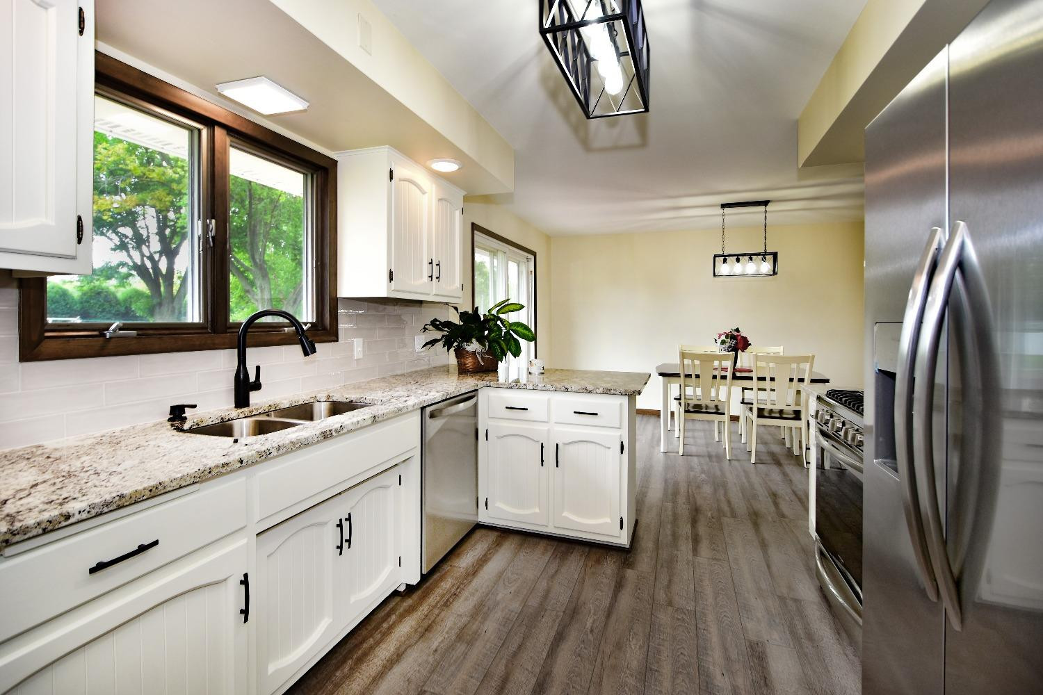 9020 Bryan Street Crown Point, IN 46307 - Photo 9 of 31 a kitchen with sink cabinets and outdoor view