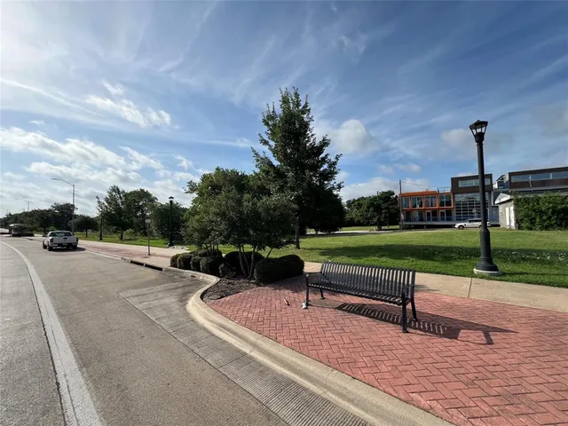 a view of a garden with sitting area