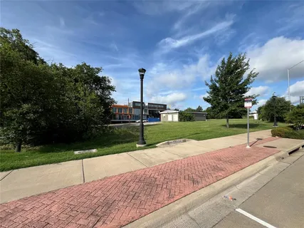 a view of a park with large trees