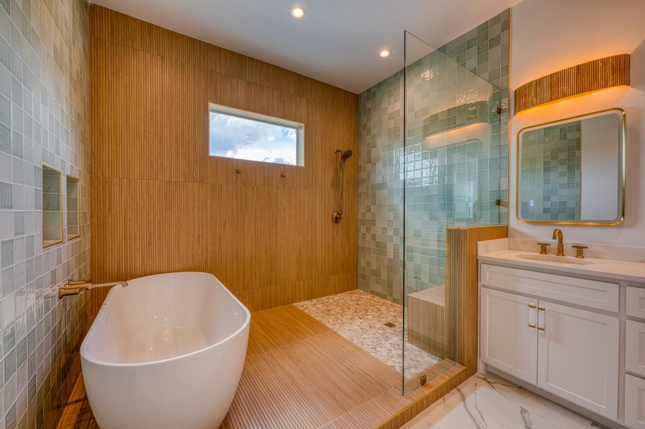 320 Lake Street Kingsland, TX 78639 - Photo 14 of 30 a bathroom with a white tub shower sink and mirror