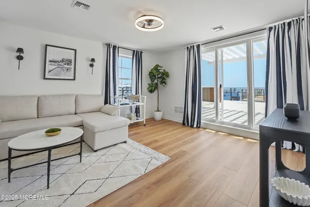 a living room with furniture and a table