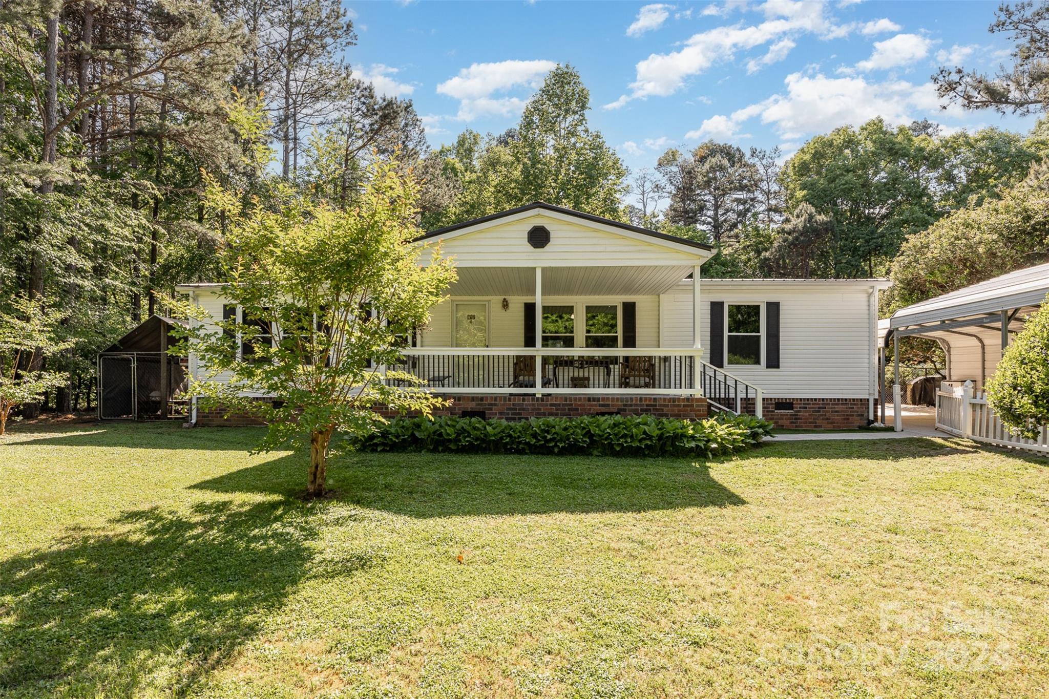 417 Old Tulip Farm Road Salisbury, NC 28147 - Photo 1 of 35 a front view of a house with a yard
