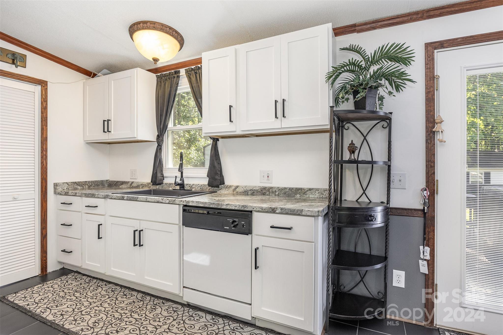 417 Old Tulip Farm Road Salisbury, NC 28147 - Photo 13 of 35 a kitchen with stainless steel appliances granite countertop a stove a sink and a refrigerator