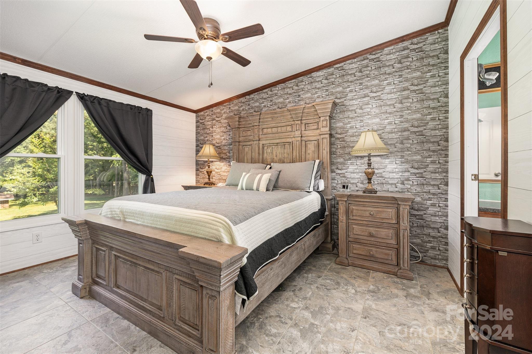 417 Old Tulip Farm Road Salisbury, NC 28147 - Photo 14 of 35 a bedroom with a bed dresser and a large window