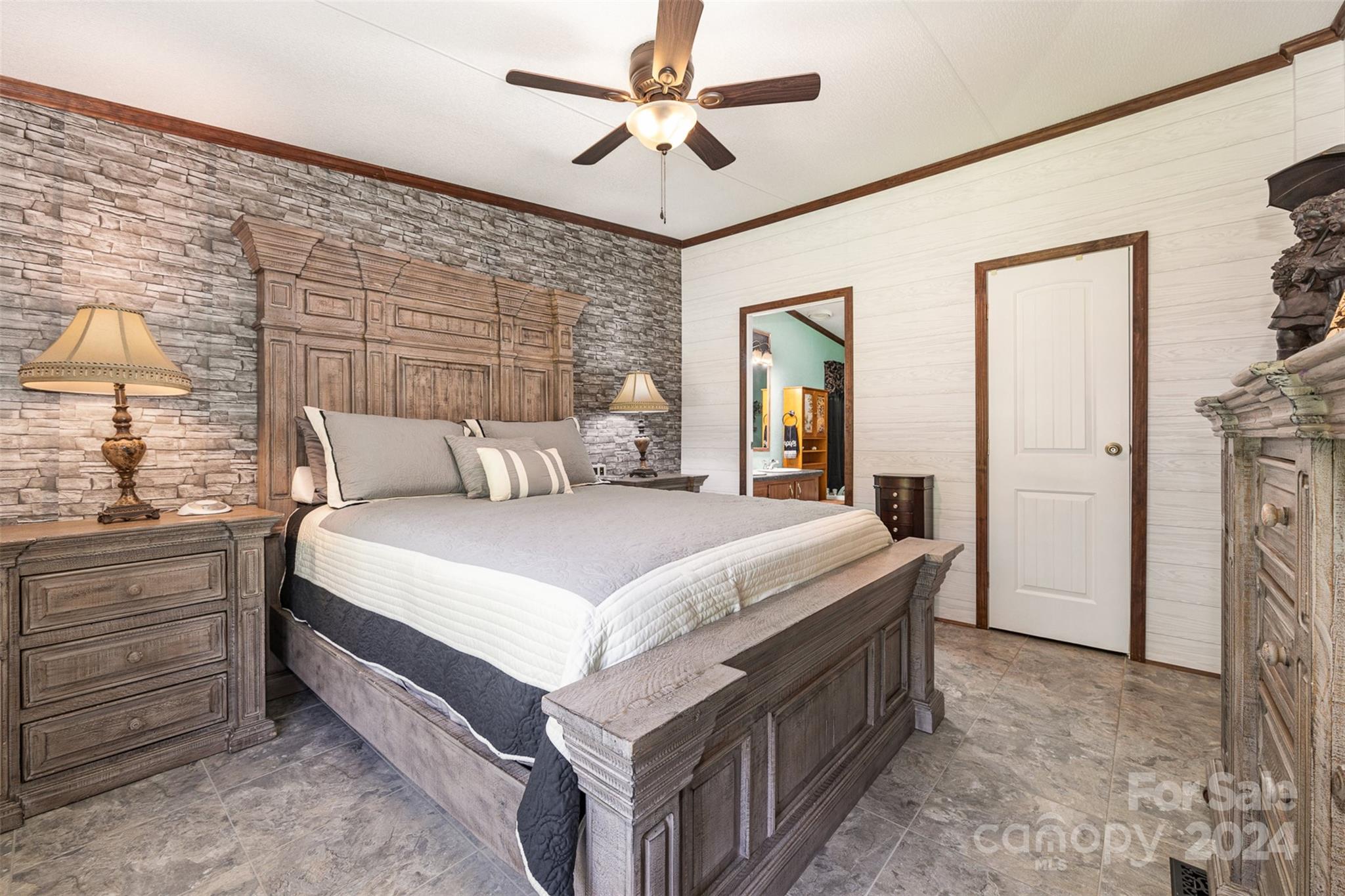 417 Old Tulip Farm Road Salisbury, NC 28147 - Photo 15 of 35 a bedroom with a bed and a chandelier