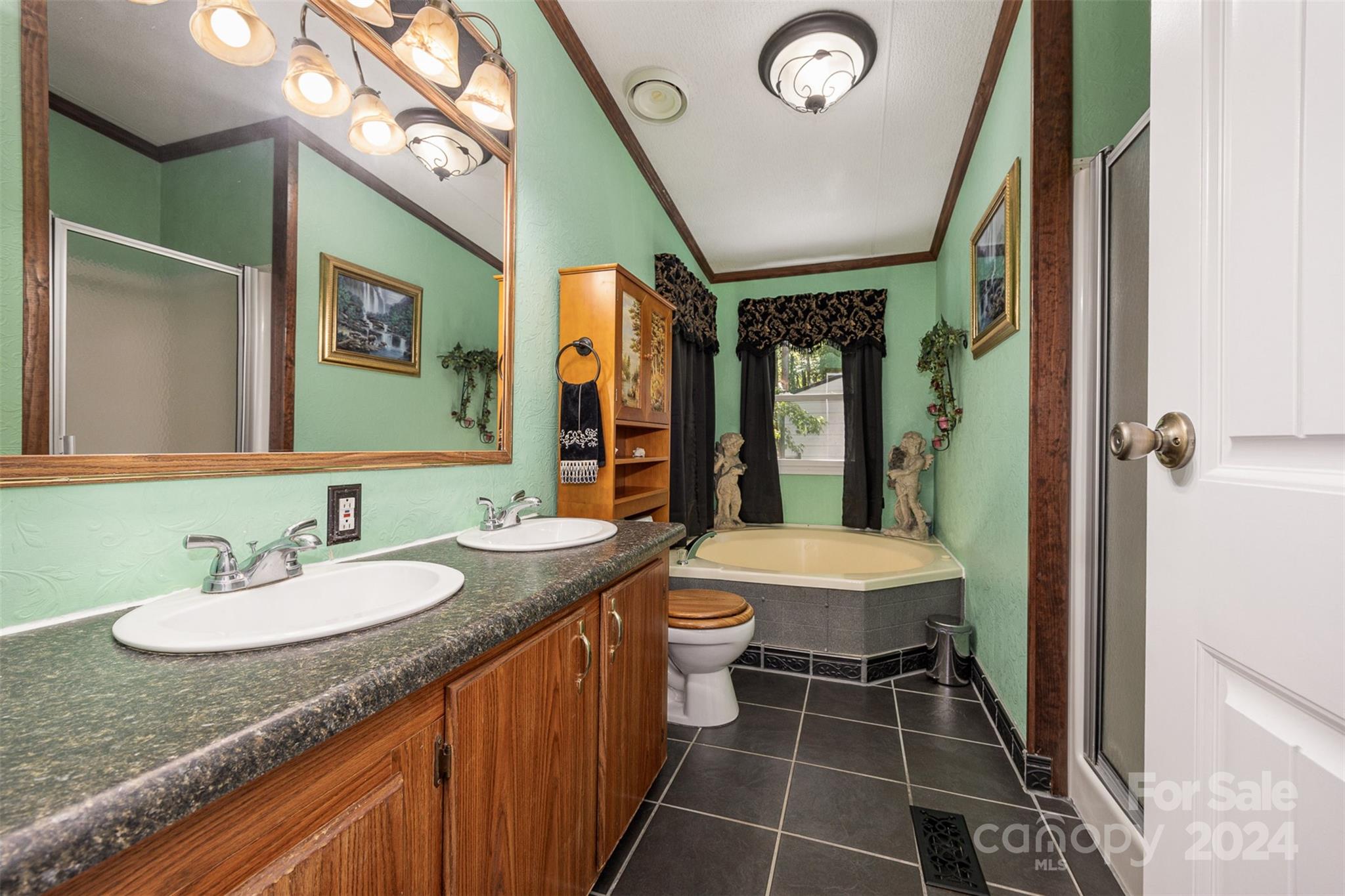 417 Old Tulip Farm Road Salisbury, NC 28147 - Photo 16 of 35 a bathroom with a sink a toilet a mirror and shower