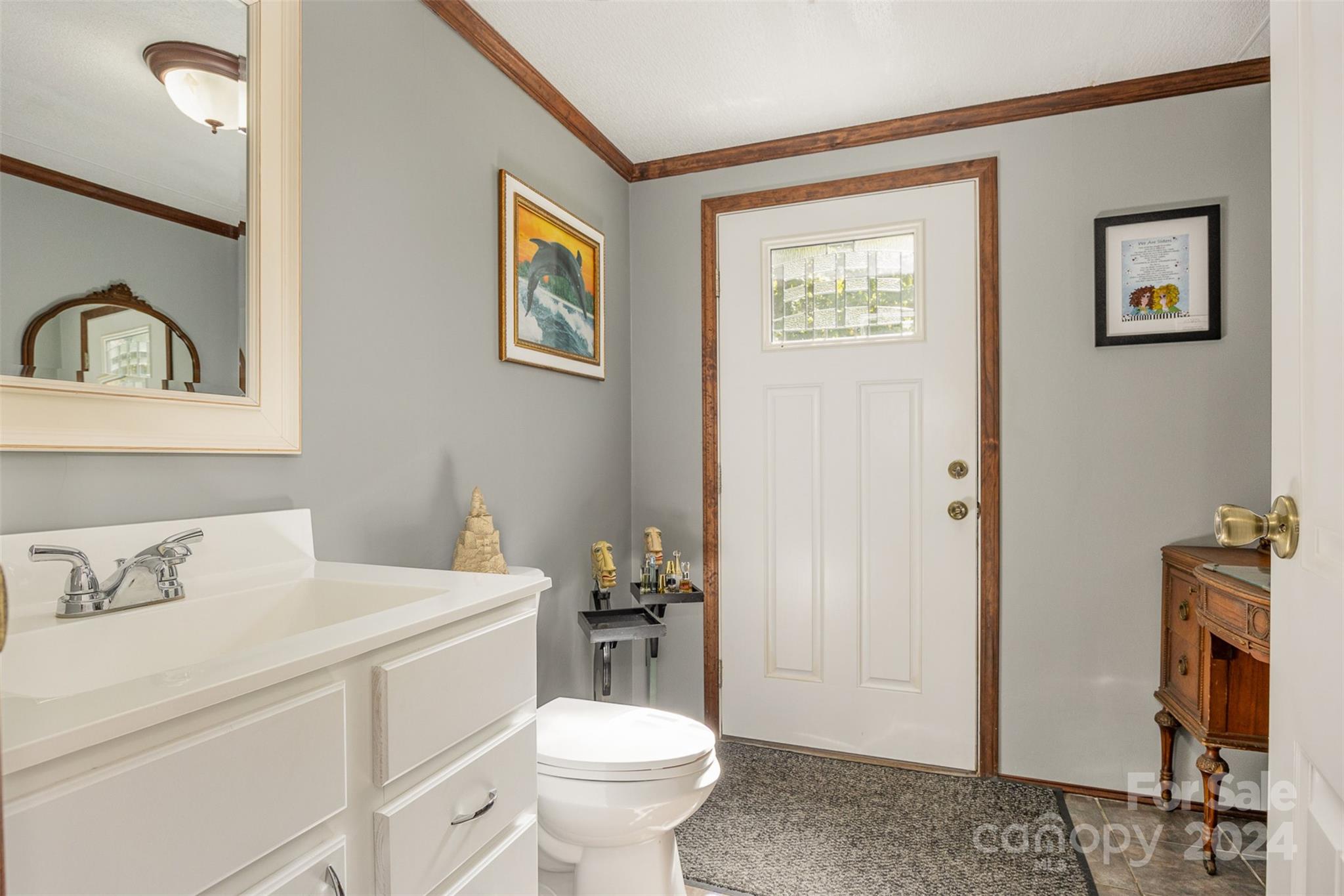 417 Old Tulip Farm Road Salisbury, NC 28147 - Photo 18 of 35 a bathroom with a toilet sink and mirror