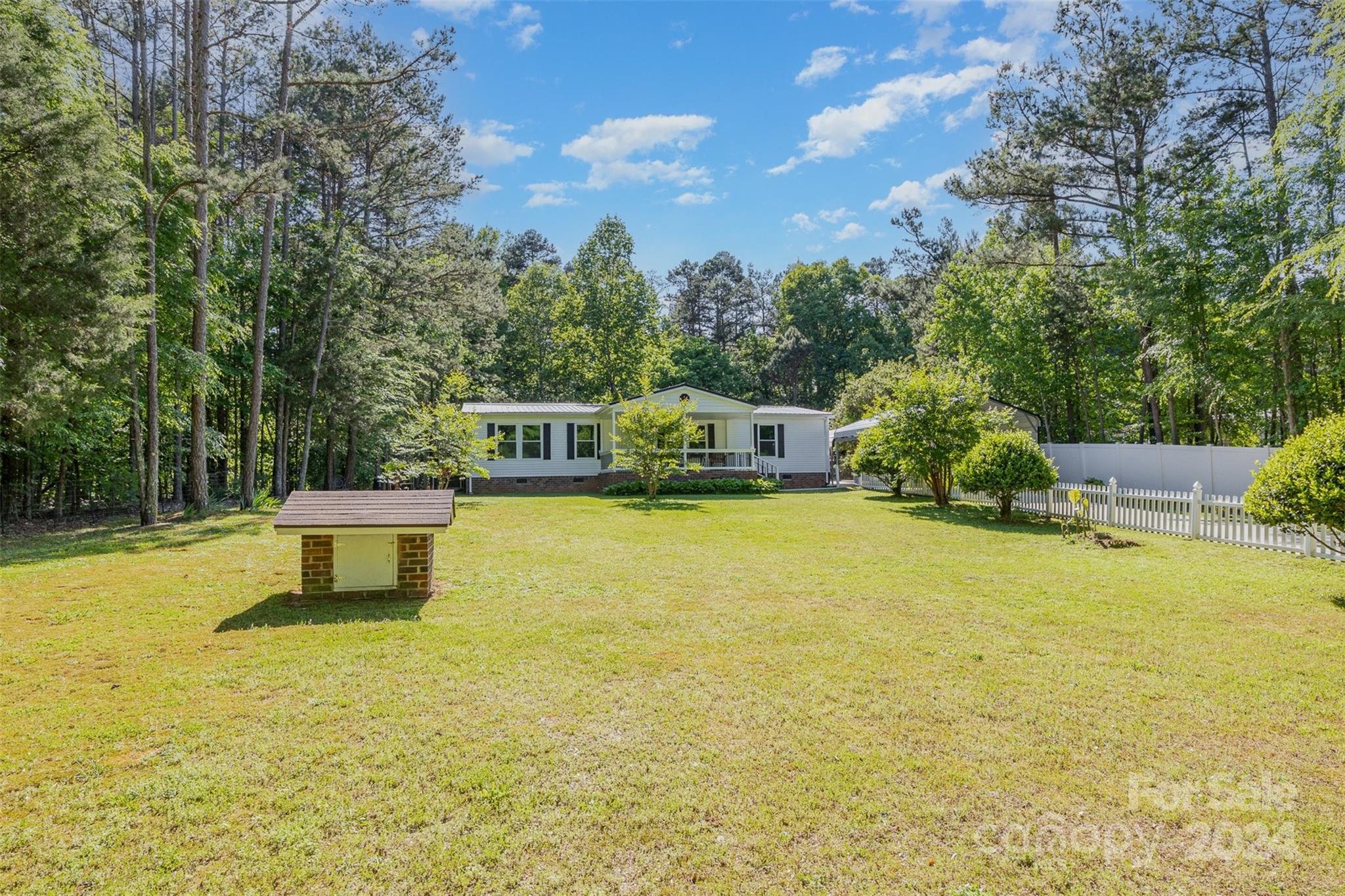 417 Old Tulip Farm Road Salisbury, NC 28147 - Photo 2 of 35 a house view with a swimming pool
