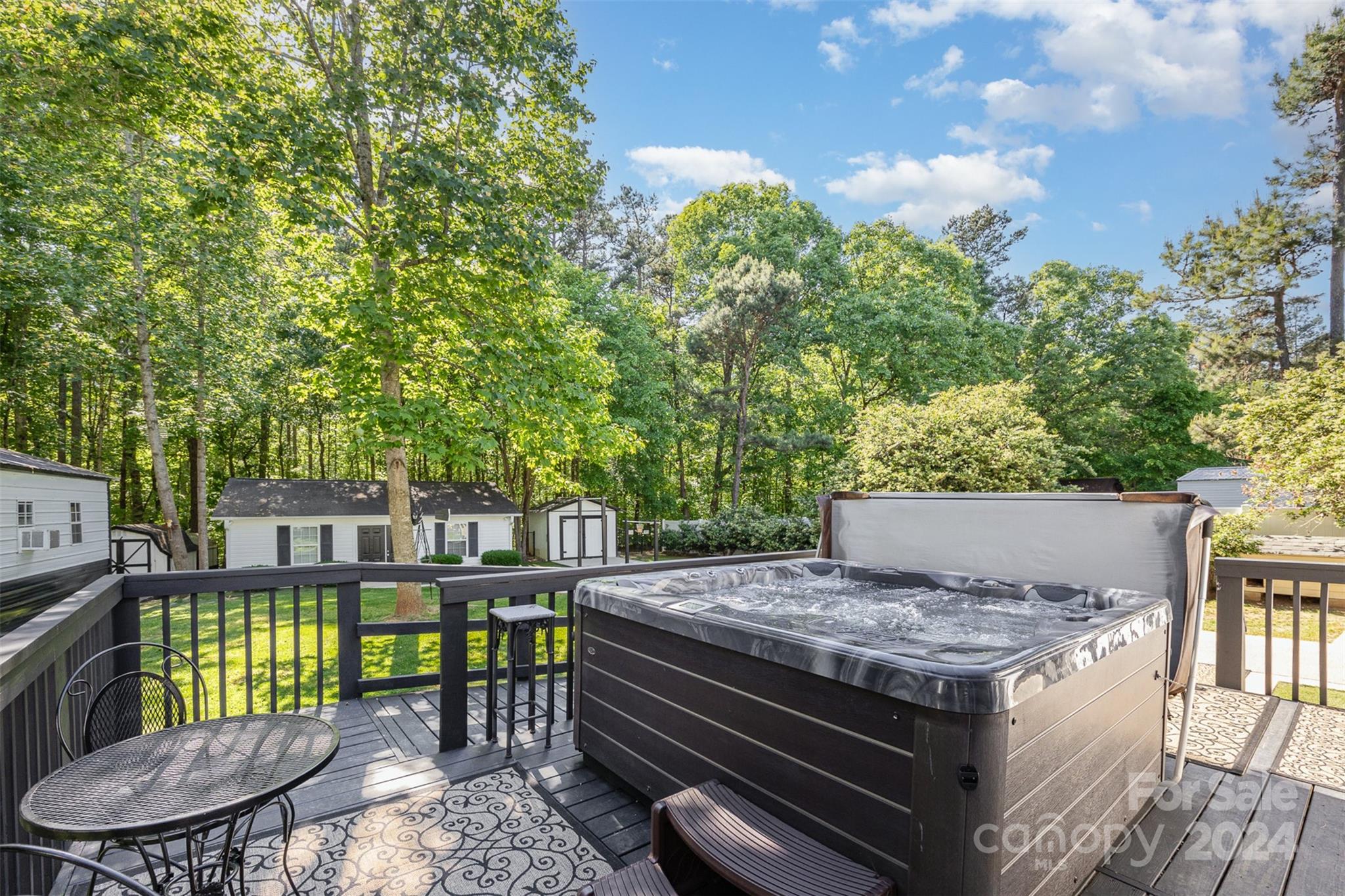 417 Old Tulip Farm Road Salisbury, NC 28147 - Photo 25 of 35 a view of a patio with table and chairs with wooden floor and fence