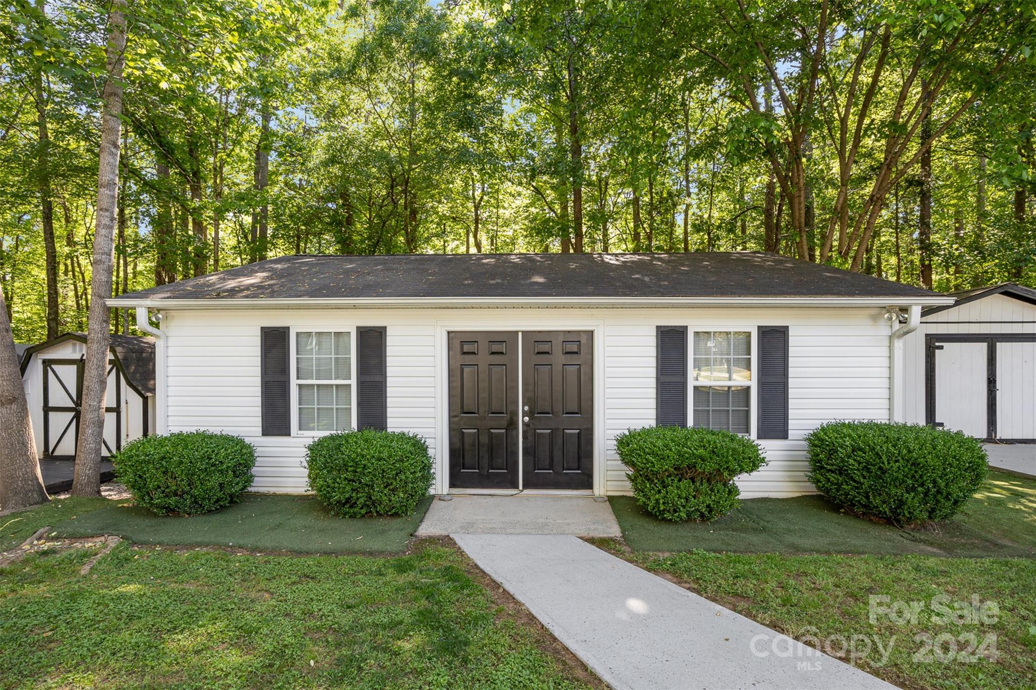 417 Old Tulip Farm Road Salisbury, NC 28147 - Photo 28 of 35 a view of a house with backyard and a tree