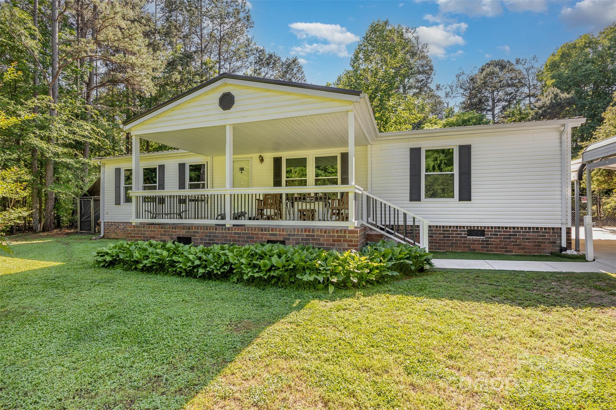 417 Old Tulip Farm Road Salisbury, NC 28147 - Photo 3 of 35 a front view of a house with a garden