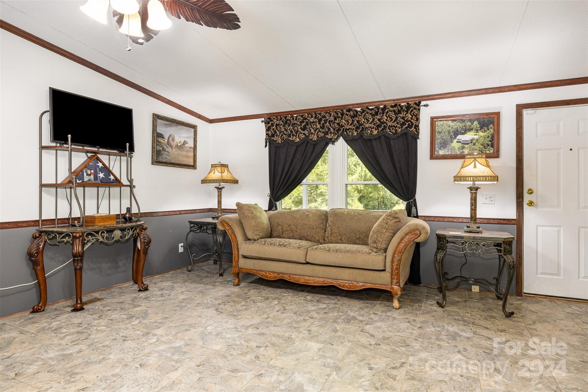 417 Old Tulip Farm Road Salisbury, NC 28147 - Photo 7 of 35 a living room with furniture and a flat screen tv
