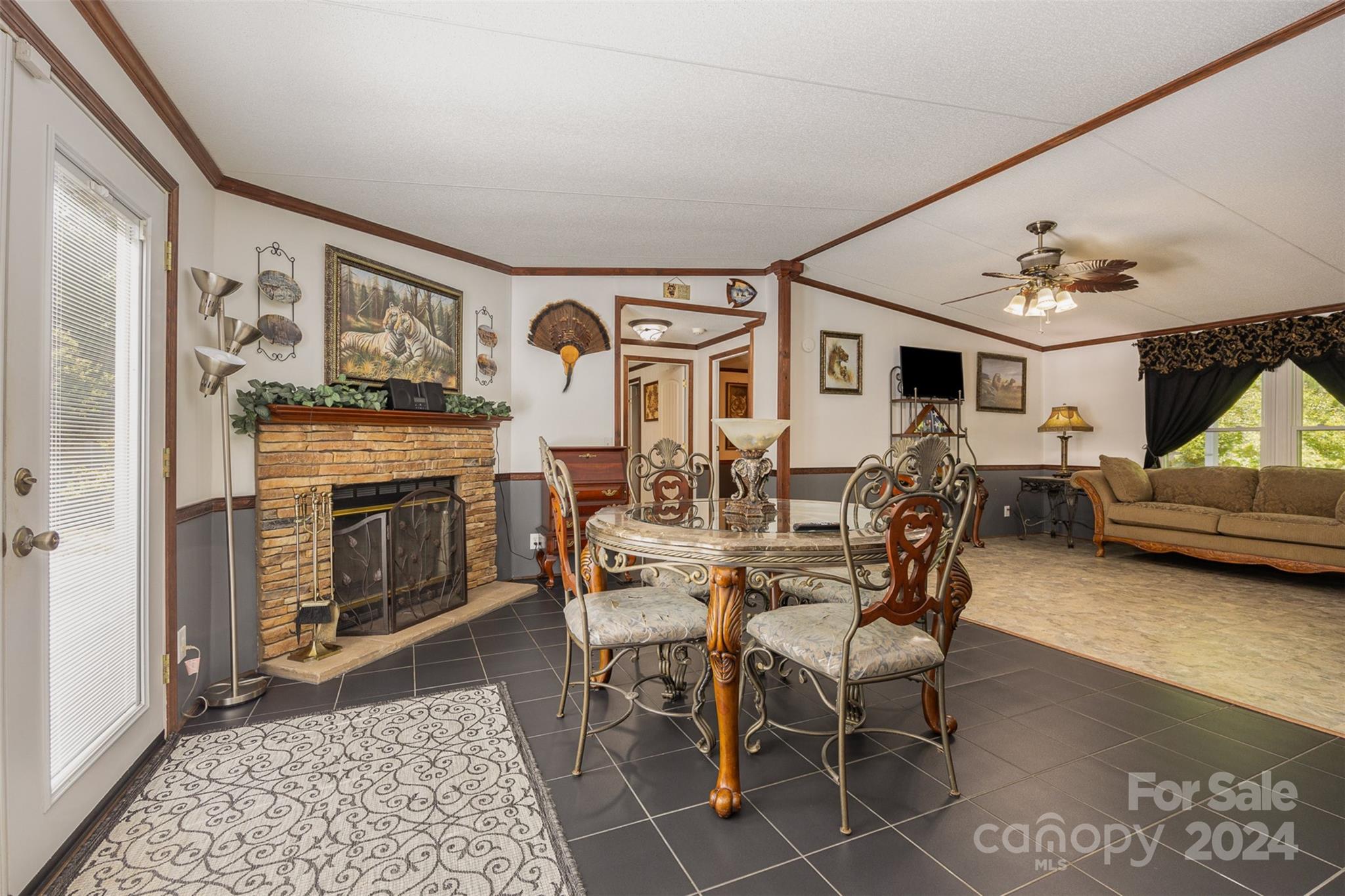 417 Old Tulip Farm Road Salisbury, NC 28147 - Photo 10 of 35 a living room with furniture a fireplace and a table