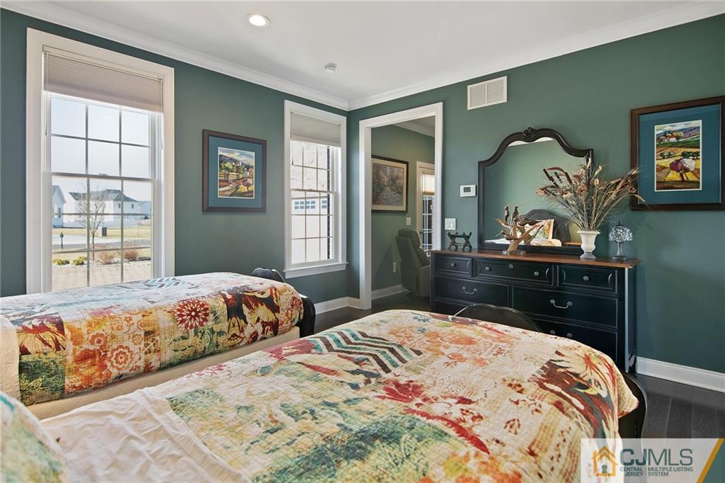25 Preakness Drive Monroe Township, NJ 08831 - Photo 16 of 48 a bedroom with a bed and a dresser