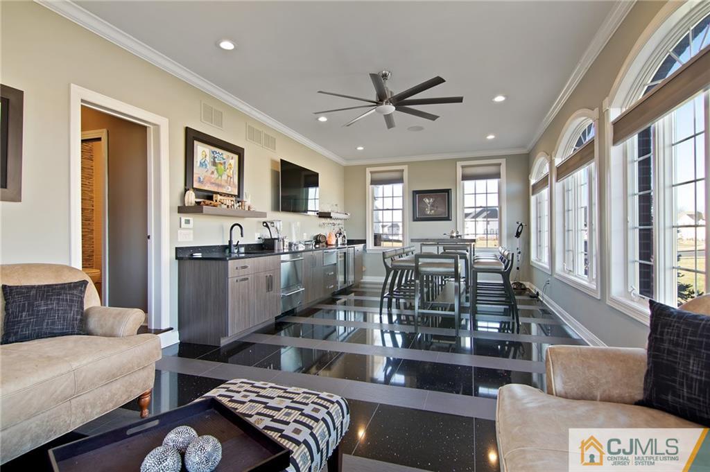 25 Preakness Drive Monroe Township, NJ 08831 - Photo 18 of 48 a living room with furniture kitchen view and a large window